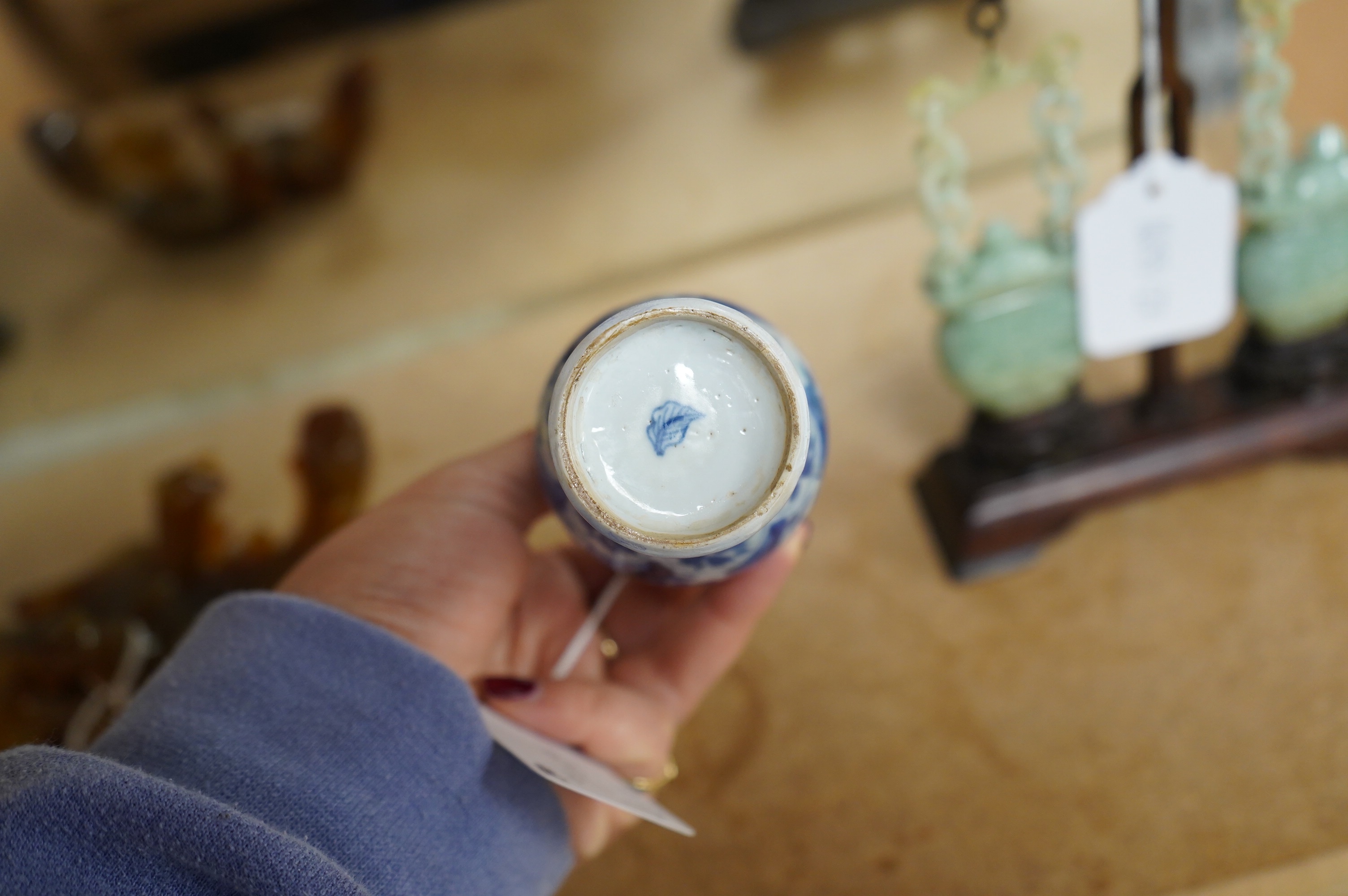 A Chinese small blue and white, white metal mounted vase, Kangxi, 12cm. Condition - poor to fair